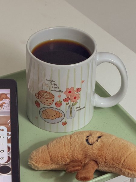 كوب جديد بعبارة "maybe life isn’t that serious🥐”