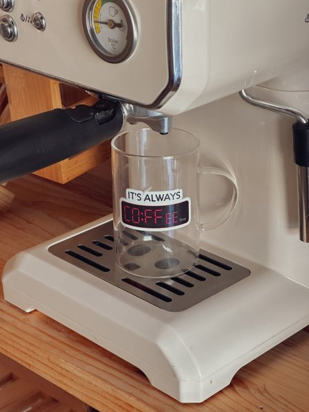 كوب شفاف بعبارة "it’s always coffe"