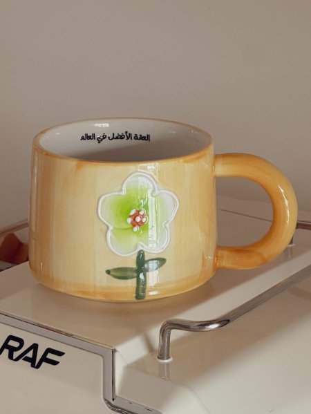 كوب بعبارة "العمة الأفضل في العالم"